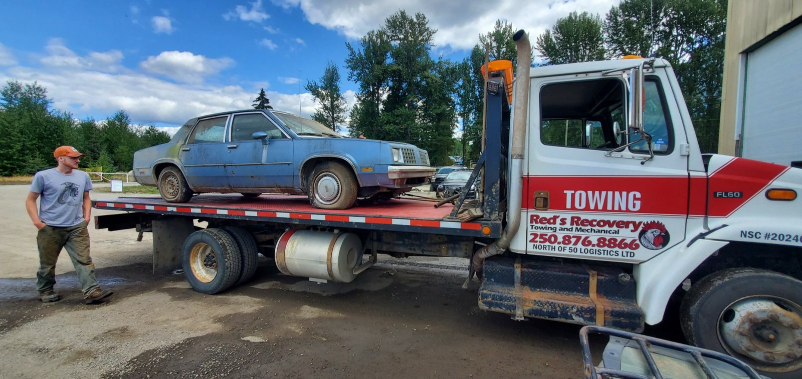 Classic car loaded on Red's Recovery flatbed tow truck in South Hazelton